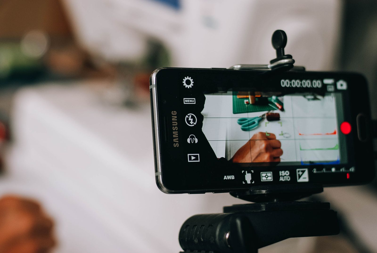 Illustrative photo of a smartphone filming handwriting
