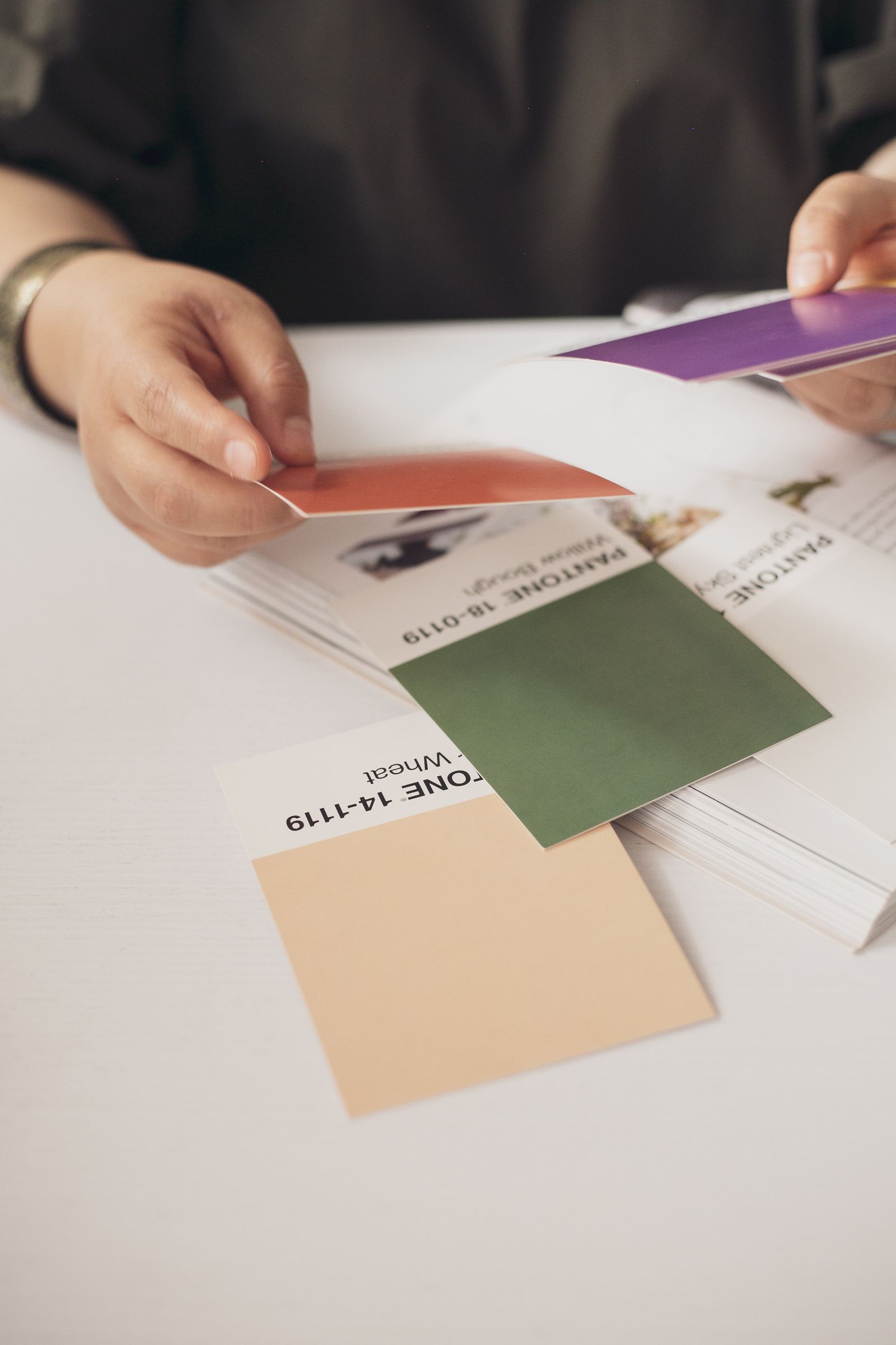 Illustrative photo of a designer reviewing color samples