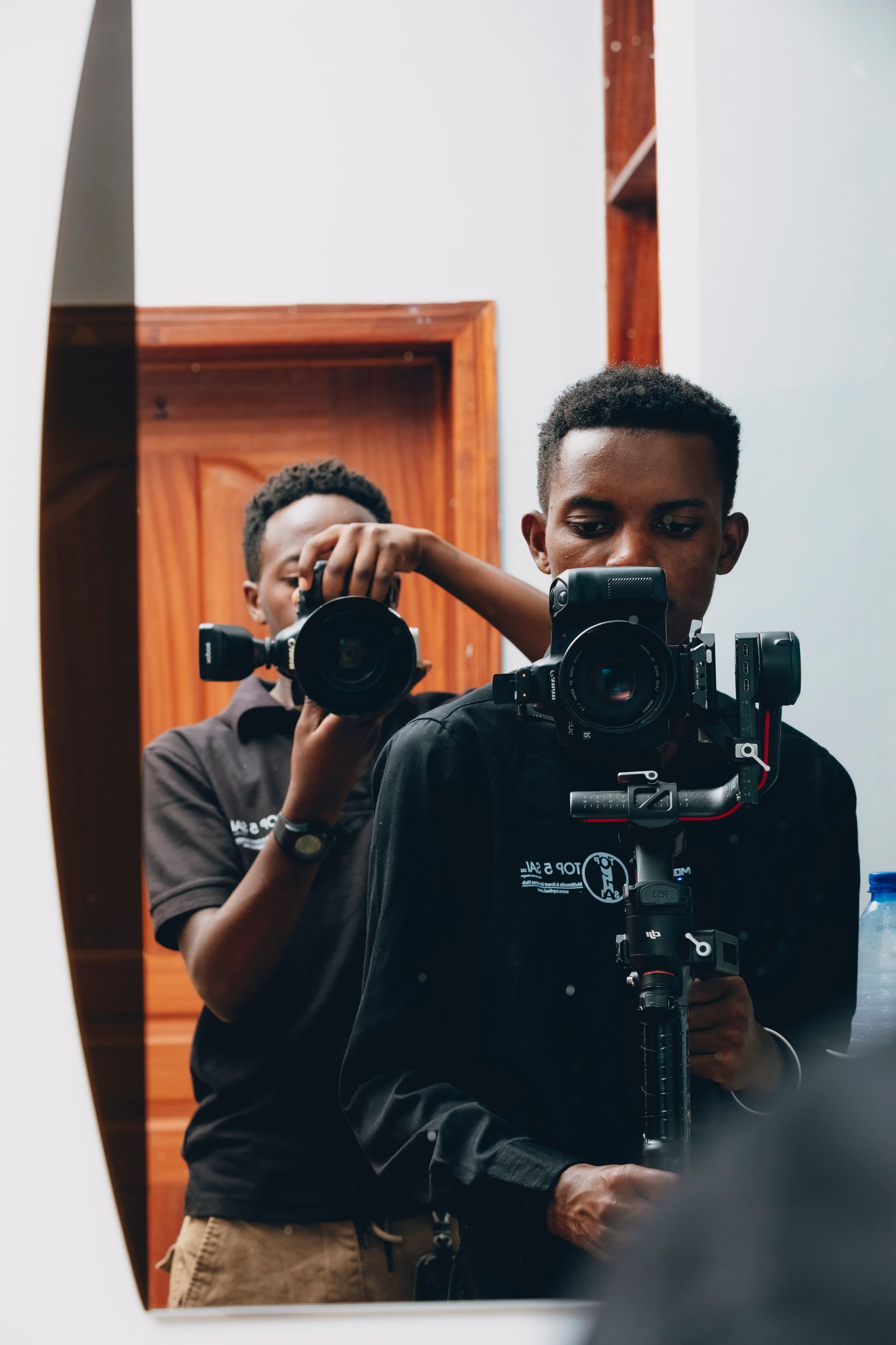 Illustrative photo of photographers capturing moments in action