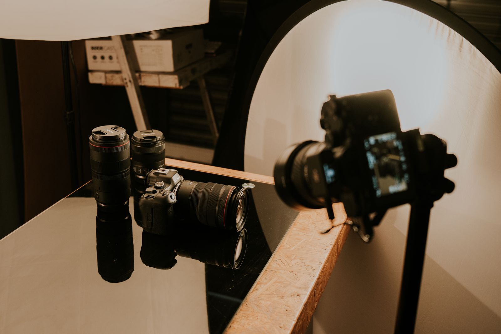 Illustrative photo of cameras and lenses on a table