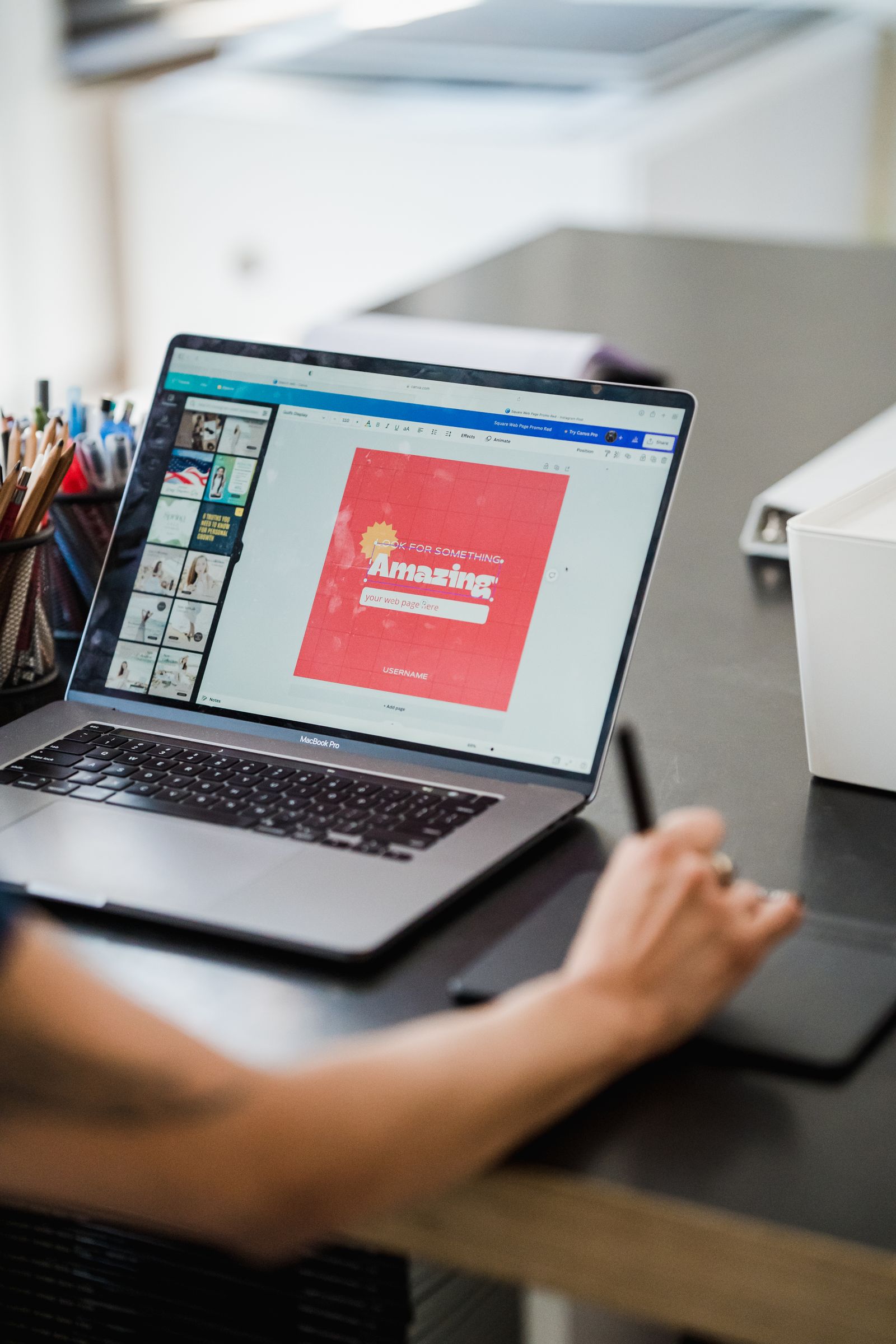 Illustrative photo of a person working with graphics on a screen