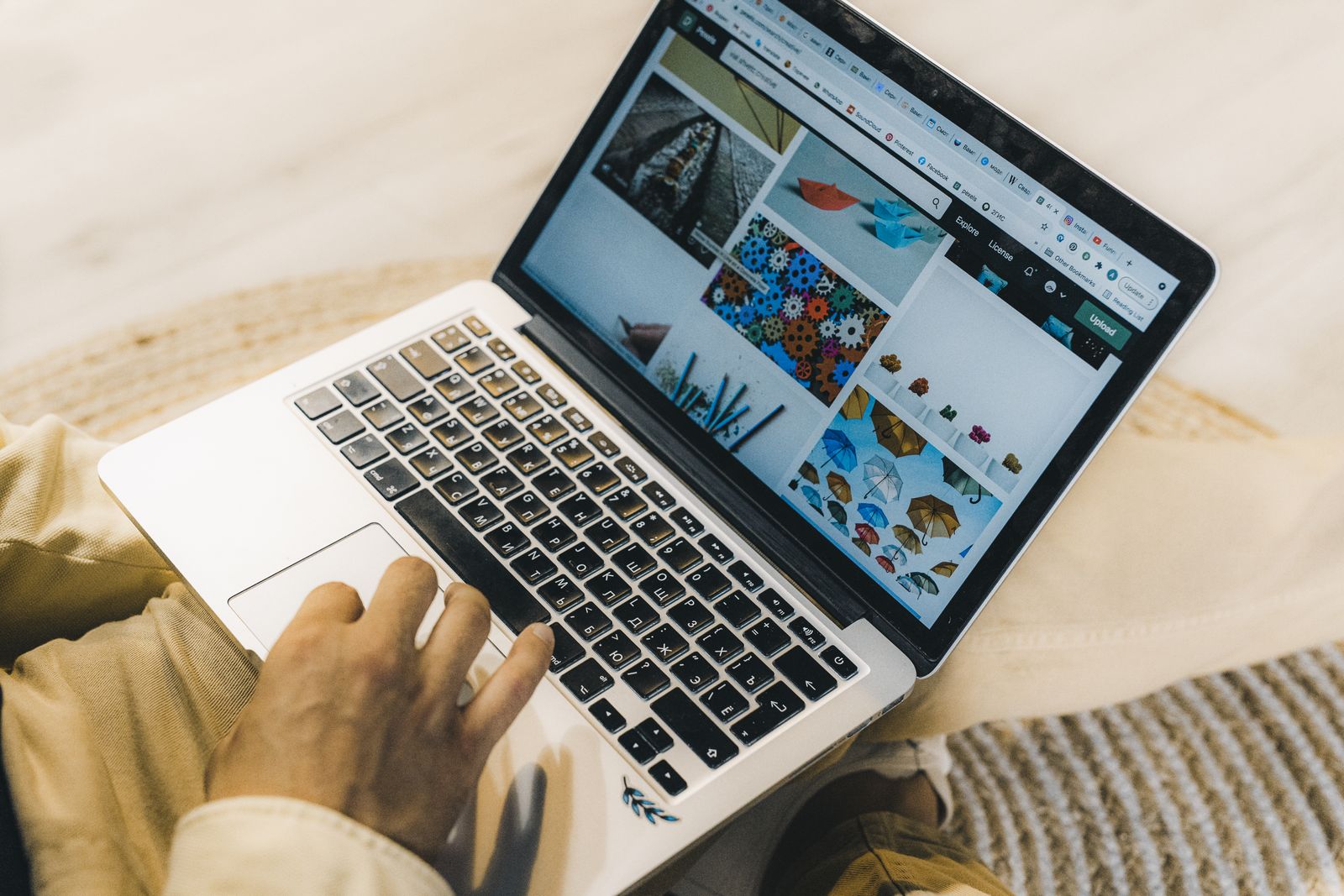 Illustrative photo of a person using a laptop for web work